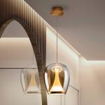 LED závesné svietidlo Suspiro, Ø 25 cm, zlatá/jantárová, sklo